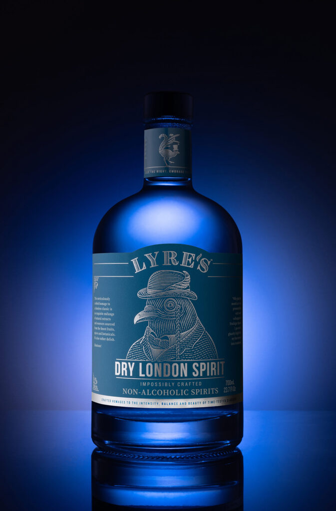 A bottle with a blue filter over the image creating a dark outline of a bottle of alcohol free lyres Gin. Photographed by Aberdeen food and drink photographer Scott Cameron Baxter.