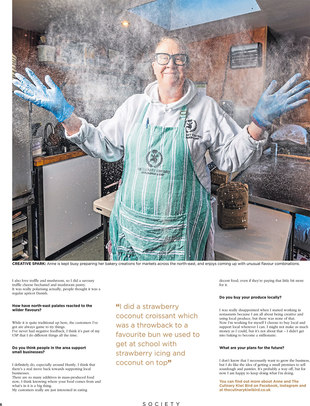 Press Photographer Aberdeen - Scott Cameron Baxter. The Culinary Kiwi Bird Baker. A woman claps her hands with flour creating a cloud of powder. she smiles at the camera in her bakery, she is wearing a green and white striped apron with blue gloves. Picture taken by Food and drink photographer Scott Baxter, Aberdeen Scotland.
